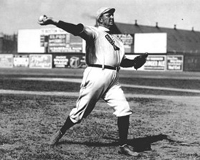 Cy Young, photographed pitching in July, 1908.