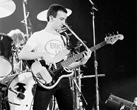 Queen bassist John Deacon playing in a 1979 concert in Dublin.